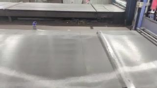 Stainless steel wire mesh is being manufactured and processed in the factory workshop.